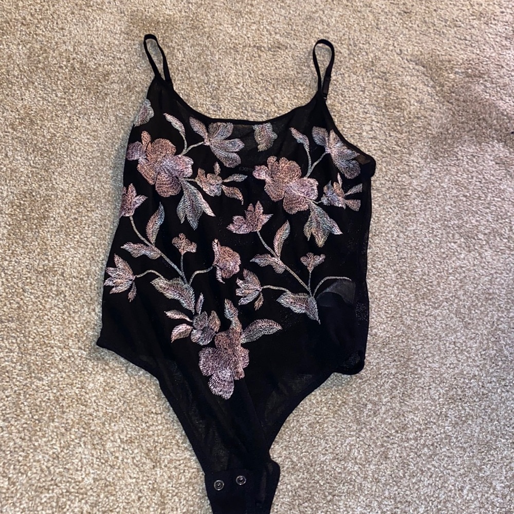 One piece flowered bodysuit . See through material
